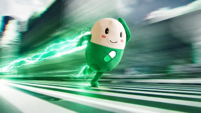 A cute, round green and white cartoon pill character runs forward at high speed with green electrical energy trailing behind it.