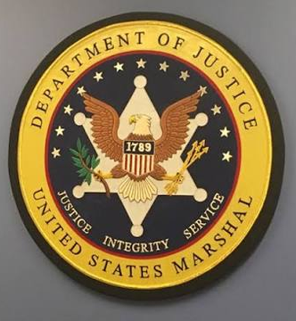 The image displays the official seal of the U.S. Department of Justice, featuring an eagle with a shield, the year 1789, and the inscriptions "Justice, Integrity, Service." It relates to the post as it represents the government agency responsible for managing the seized Bitcoin and Tether from the Bitfinex hack and FTX-Alameda, now transferred to Coinbase Prime.