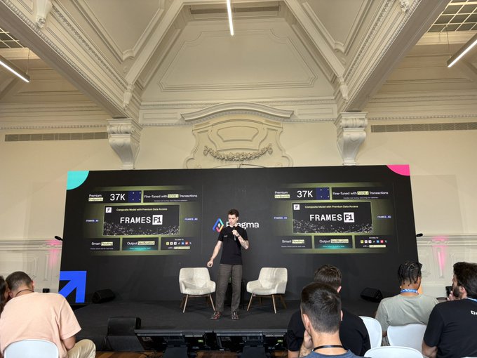 A man presents on stage at a Figma event, with large screens behind him displaying "FRAMES F1" and Figma statistics including "37K".