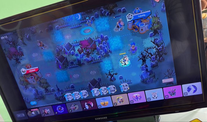 A Samsung tablet screen displays a mobile strategy game with a graveyard/cemetery theme, showing in-game currency of 9995 and various unit cards at the bottom.