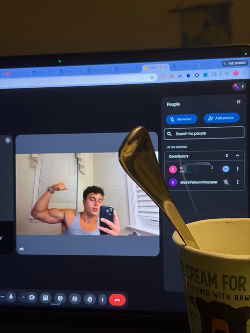 A young man in a gray tank top flexes his bicep for a mirror selfie during a Google Meet call titled "Contributors," while an ice cream cup sits in the foreground. The image humorously captures the "digital gold rush" vibe—working from home in casual clothes (or barely any), showing off gains between video meetings, and eating dessert at the computer.