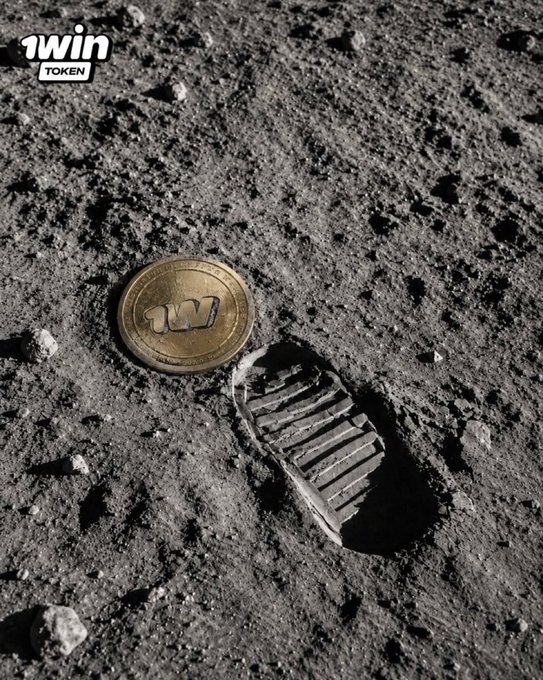 A gold 1WIN TOKEN coin rests on a gray, rocky lunar-like surface next to a boot print impression.