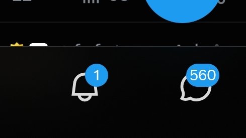 A close-up of Twitter notification icons showing a bell icon with 1 notification and a message icon with 560 notifications.