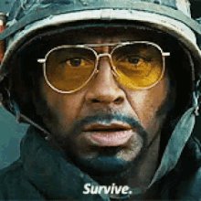 The image features a man wearing sunglasses, possibly an actor from the movie " BTC nuking While Manifest Is Holding Up Well". The caption below the photo reads "Survive", which could be a reference to the movie or a personal message related to the character's journey in the film.

The post also mentions that the character is holding up well and has been through some tough times, possibly indicating the character's resilience.