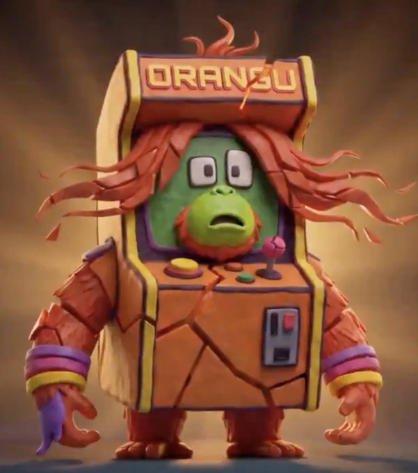 A stylized 3D-rendered character depicts a cracked, battle-damaged arcade cabinet with orange flame-like hair and the word 'ORANGU' on its marquee, featuring a green face with a worried look.