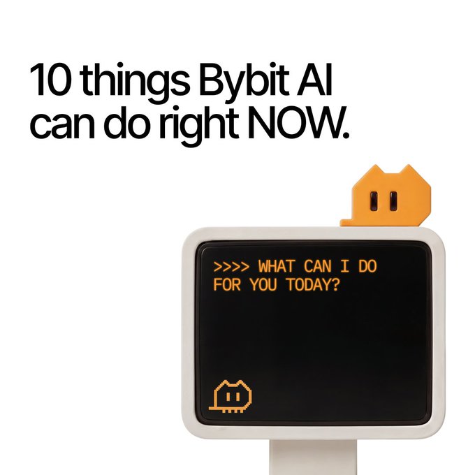 A retro-style white computer monitor with a pixelated orange cat peeking over the top displays the orange pixel-text ">>>> WHAT CAN I DO FOR YOU TODAY?" The image illustrates the post's theme of "10 things Bybit AI can do right now," using a nostalgic, AI-assistant aesthetic to introduce Bybit's AI capabilities.