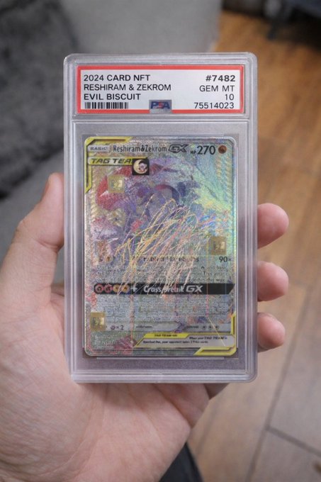 The image shows a person holding up a card with a Pokémon graphic, likely a Pokémon card from an online store like eBay or Amazon that offers these digital cards as gift items. The card appears to have been used and is now being held by someone who possibly bought it for their friend or family member. The post mentions the "Biscuit" of some sort, which may be related to the card's origin or another aspect of the Pokémon collection, but without more information, it cannot be confirmed.