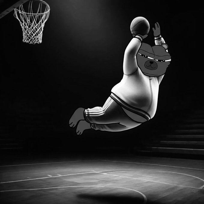The image features a cartoon depiction of a basketball player, likely a bear or a cat, jumping into the air with a basketball above their head while wearing a white jacket and striped pants. The scene takes place at an indoor basketball court, which is well-lit by spotlights highlighting the action on the court. The caption "History in the making $BOBO" suggests that this image could be part of a series or collection showcasing various basketball players' poses and actions over time.