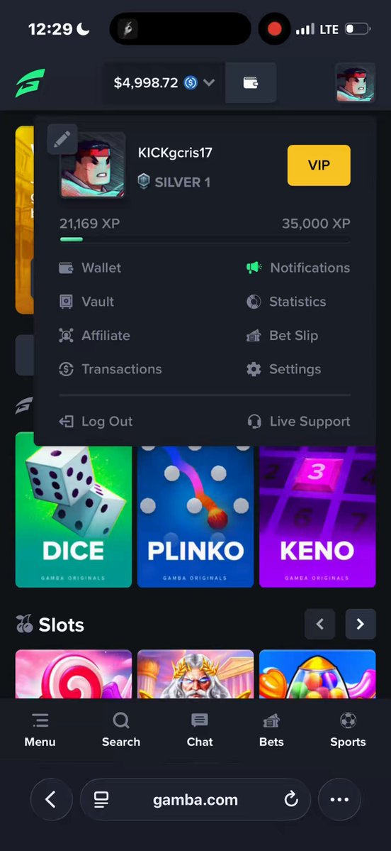 In this image, there's a cellphone screen showing various app icons including one for a casino game called "Gemba". The main focus of the image appears to be a screenshot from an iPhone display featuring a shopping app with multiple options such as gambling games, searching and more. An important aspect of the image is the information about spending money on the app or using in-game purchases, which might lead one to question whether they've spent $4,000 at the mall or deposited $5,000 for playing casino games.