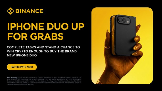 A Binance promotional banner features a yellow "PARTICIPATE NOW" button and large text reading "IPHONE DUO UP FOR GRABS," inviting users to complete tasks for a chance to win crypto for a new iPhone Duo, alongside an image of a hand holding two iPhones against a yellow background. The banner directly supports the post's call to action about the bStocks challenge upgrade, where completing eligible trades offers a chance to win the iPhone Duo grand prize.