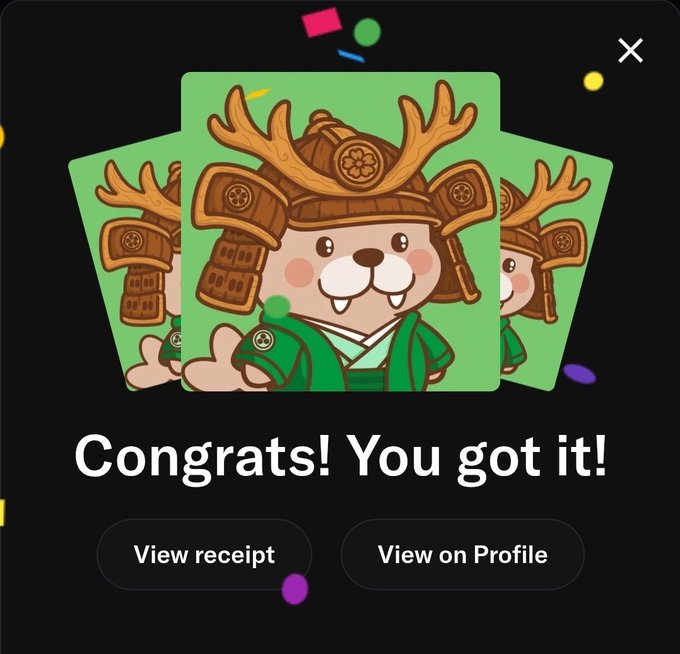 A pop-up congratulating the user on obtaining a cartoon character card, showing a smiling animal in traditional samurai armor with antlers on a green background.