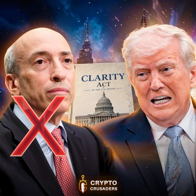 The image features two men dressed in suits, one wearing a red tie and the other wearing a blue tie. They are standing next to each other with their arms crossed over their chests. The background of the image shows a city skyline at night, with buildings illuminated against the dark sky. In the foreground, there is an open book titled "Clarity Act" written in white text on a black background. The title and the presence of the book suggest that it might be related to cryptocurrency or blockchain technology.