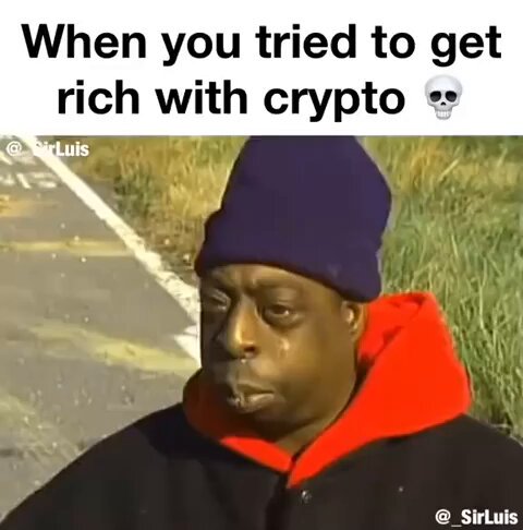 The image features a man wearing a black jacket with an orange hood, sitting on the side of a road or street. He has a sad expression on his face as he looks down at something. The caption below the photo reads "When you tried to get rich with crypto", which is related to Bitcoiners life and the post about Bitcoiners life.