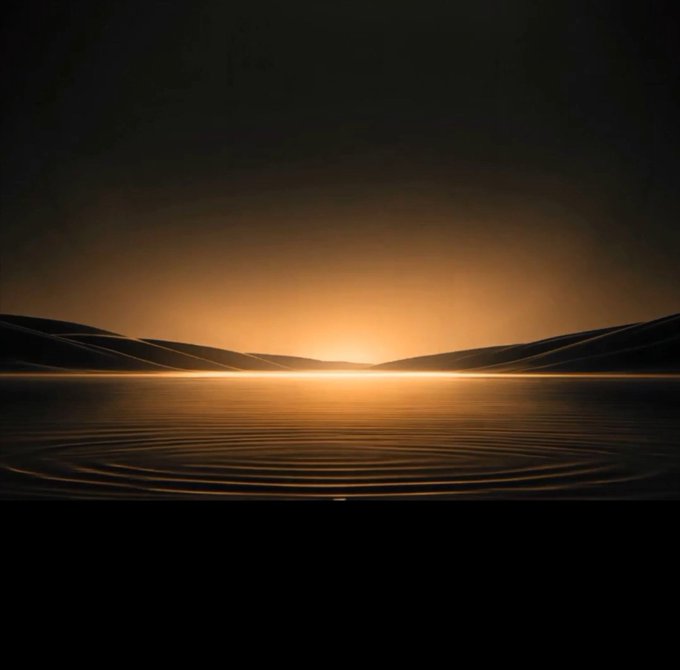 A minimalist digital artwork featuring a glowing golden sunset or sunrise over a rippling body of water, framed by dark silhouetted hills against a gradient amber and black sky.