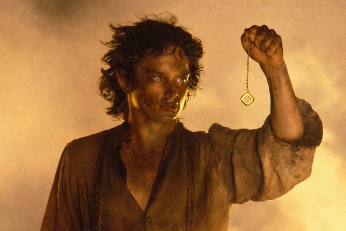 The image features a man holding a gold pendant, which appears to be a key or a lock, as he stands against a yellow background. The caption of the image reads "Pendle is now live on @monad! First up - we're opening with 2 lovely @withAUSD pools:". This suggests that the image might be related to a social media post about the movie Pendle or something similar, as it features a man holding a key and the caption indicates that this could be an advertisement for a product.