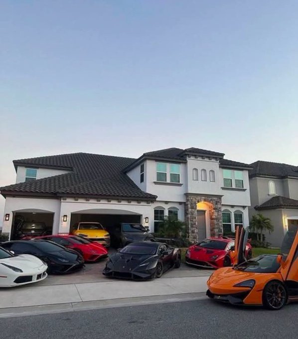 A lineup of luxury sports cars, including Lamborghinis and other high-end supercars, is parked in front of a large suburban mansion. The image embodies the post's caption "Crypto holders 2027," symbolizing the extravagant wealth and opulent lifestyle that cryptocurrency investors are projected to achieve in the future.