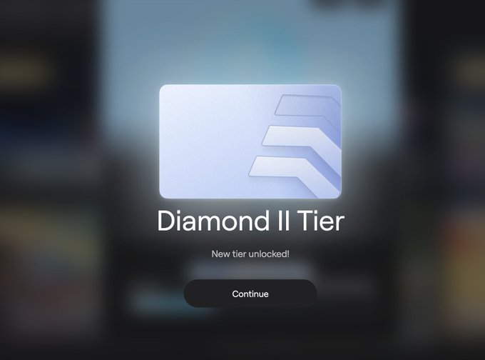 A digital notification screen announcing 'Diamond II Tier' unlocked with a 'Continue' button on a blurred background.