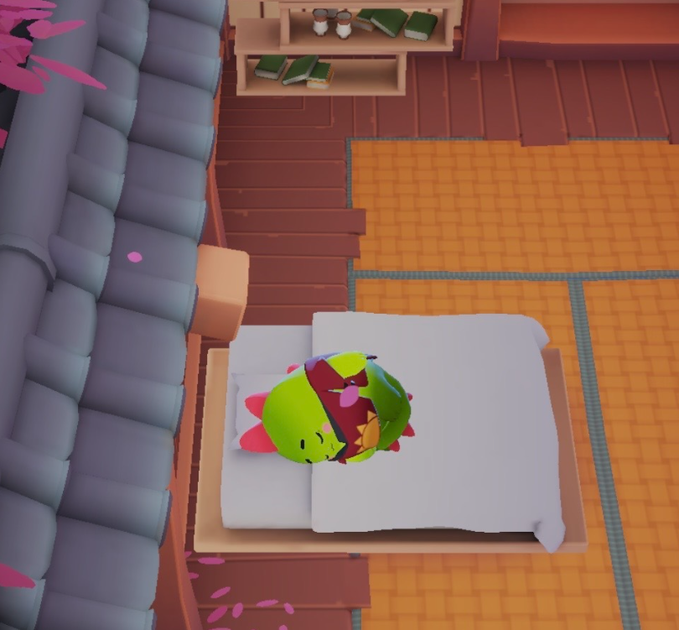 The image features a cartoon character, possibly a green dinosaur or a frog, lying down on a bed with its eyes closed. The character appears to be sleeping peacefully while surrounded by various books scattered around the room. The scene suggests that the character is taking a nap and enjoying some downtime in their cozy bedroom setting.