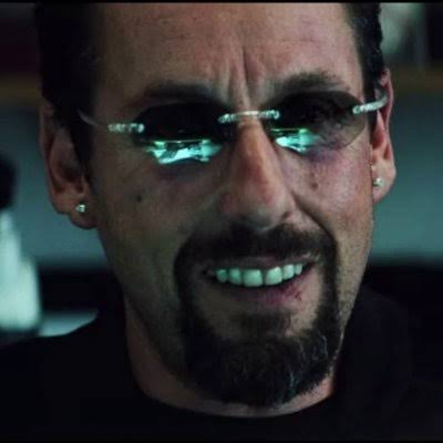 This image captures Adam Sandler's character from "Uncut Gems," known for his impulsive and often disastrous decisions. His expression mirrors the feeling of regret and foolishness associated with making bad investments, directly relating to the post's theme.