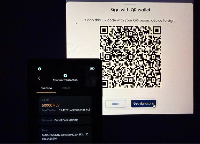 The image shows a PulseChain transaction confirmation screen on a hardware wallet displaying a transfer of 50,000 PLS with a MaxTxnFee of 13.4974 PLS, alongside a QR code on a computer screen prompting the user to "Sign with QR wallet" and "Get signature."

This illustrates the air-gapped signing process referenced in the post, where a QR code is scanned by an offline hardware wallet to authorize the transaction without ever connecting to the internet—eliminating the need to physically access a secure computer room for cold storage operations.