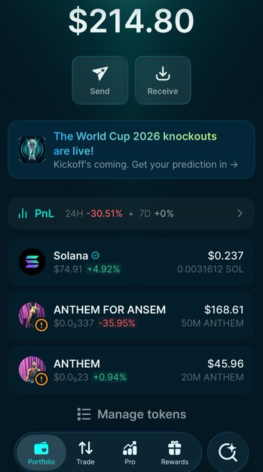 A cryptocurrency portfolio dashboard showing a total balance of **$214.80**, with the user holding **0.0331612 SOL ($74.91)** of Solana and two ANTHEM tokens (**"ANTHEM FOR ANSEM"** at $168.61 and **"ANTHEM"** at $45.96). The image relates to the post by clarifying which ANTHEM token the user actually owns versus what they may have confused it with, since they hold "ANTHEM FOR ANSEM" (an anthem dedicated to the influencer Ansem), not the person Ansem himself.
