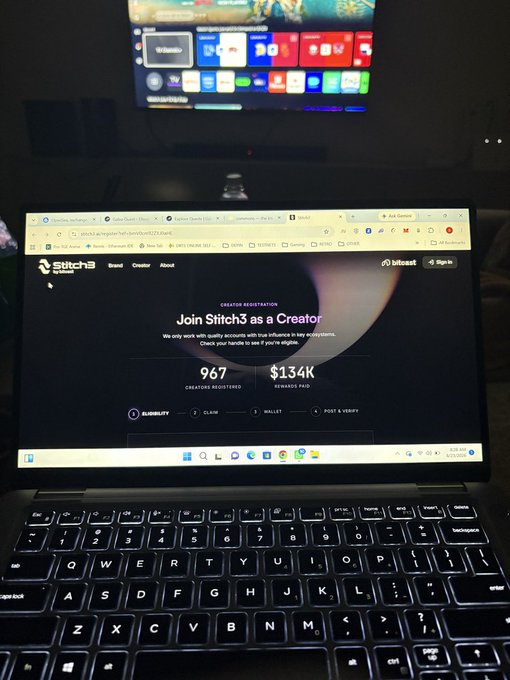 A laptop displays the Stitch3 creator registration page, showing "967 creators registered" and "$134K rewards paid," with a TV screen in the background. The image visually reinforces the post's claim about the platform's early-stage opportunity, highlighting the low number of registered creators relative to the rewards already distributed.