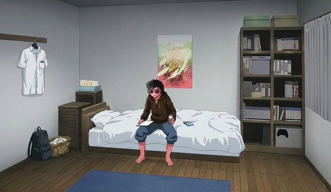 An anime-style illustration of a person with dark hair and glasses sitting on a white bed in a bedroom, wearing a brown hoodie and blue pants. The room features a white lab coat hanging on the wall, a bookshelf, a poster, and a small TV.