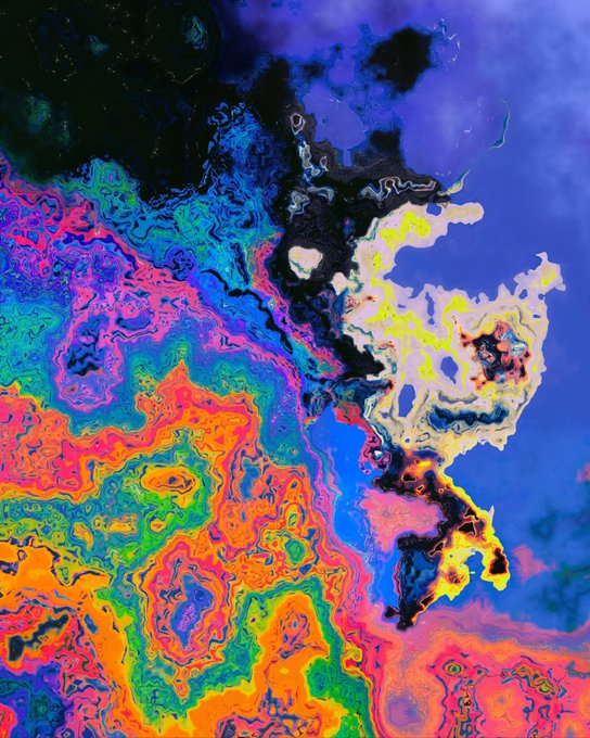 An abstract, highly colorful digital artwork featuring swirling, psychedelic patterns with vibrant blues, pinks, oranges, and greens, resembling a thermal map or fluid simulation.