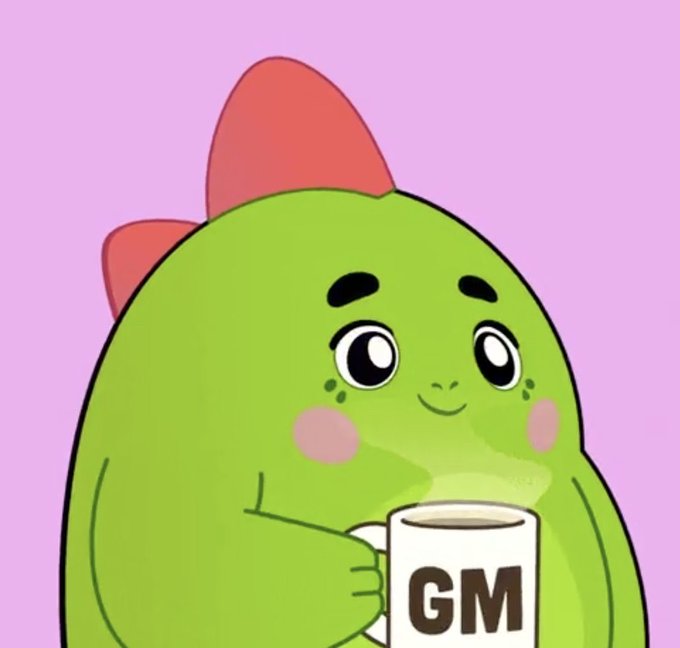 A green blob-like cartoon character with a red bow holding a white mug labeled 'GM' against a pink background.