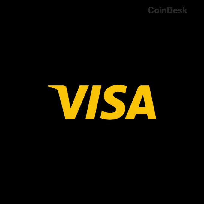The yellow Visa logo is displayed prominently against a black background, with a 'CoinDesk' watermark in the upper right corner.