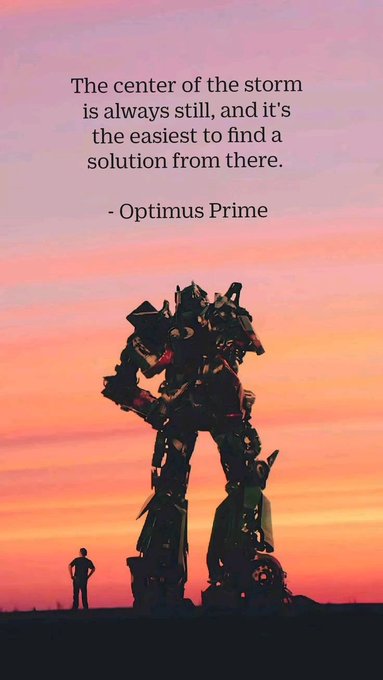 An inspirational image with a quote: 'The center of the storm is always still, and it's the easiest to find a solution from there. - Optimus Prime,' set against a sunset silhouette of the Transformers robot and a small human figure.