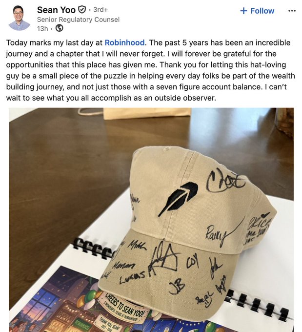 The image features a tan baseball cap with black writing on it that says "BREAKING: $HOOD SENIOR REGULATORY COUNSEL, SEAN YOO, DEPARTS AFTER 5 YEARS". The caption above the photo reads "BREAKING: $HOOD SENIOR REGULATORY COUNSEL, SEAN YOO, DEPARTS AFTER 5 YEARS". This post seems to be a tribute or acknowledgment of someone's work or accomplishments after five years.