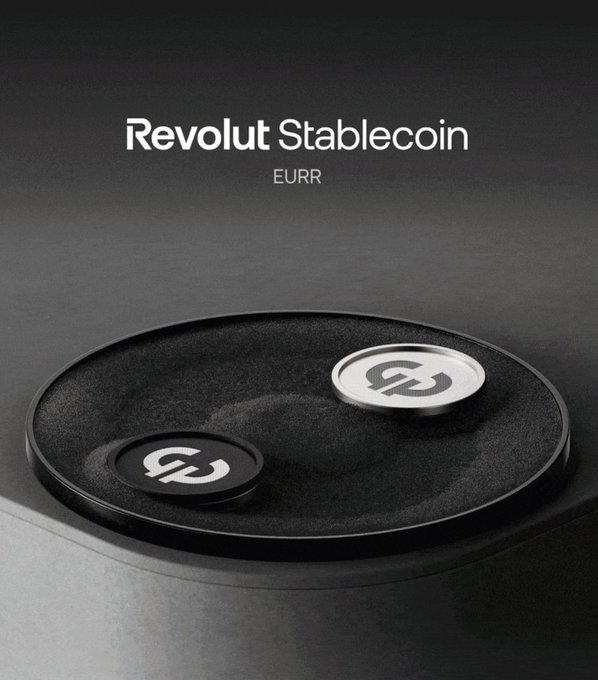 A dark, monochromatic product image for "Revolut Stablecoin" labeled "EURR," showing two stylized tokens—black and silver—each bearing a chain-link "link" emblem, displayed on a circular black platform. The image visually introduces Revolut's newly launched euro-denominated e-money token issued under MiCA, echoing the post's announcement of its availability through Bridge's European entity.