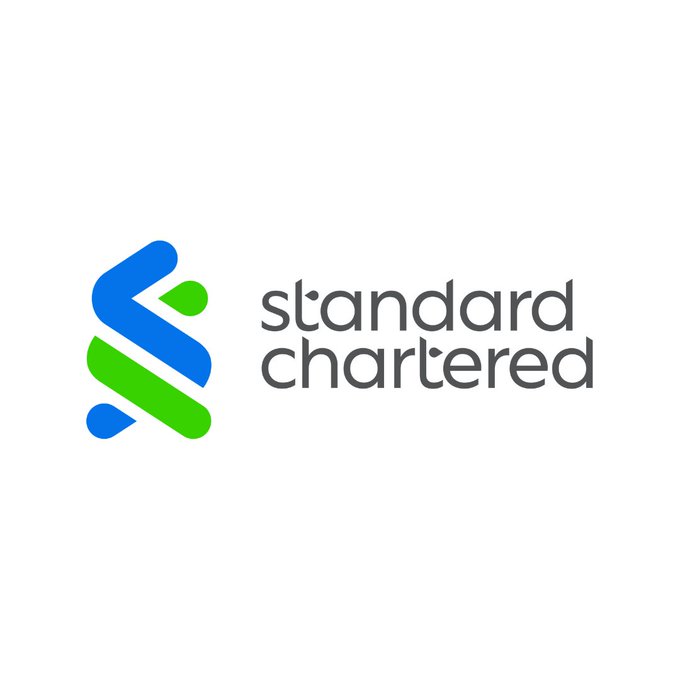 The image shows the Standard Chartered logo, featuring a stylized blue and green emblem alongside the company name in gray lowercase text. This relates to the post as it identifies Standard Chartered as the financial institution whose analyst, Geoff Kendrick, issued the bullish $100 price target on UNI (Uniswap) token.