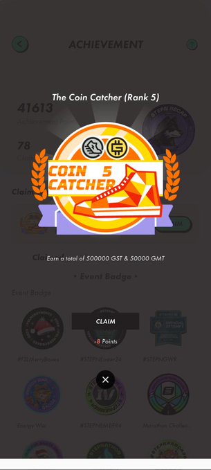 The image shows a phone screen displaying an achievement badge for a coin catchers game, which has been completed. The badge features a gold circle with a red triangle inside, surrounded by orange and white text that reads "The Coin Catcher (Rank 5)". There are also other badges visible on the screen, indicating various achievements in different games or activities.