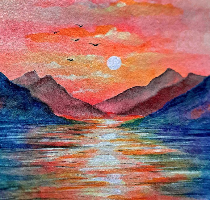 A watercolor painting depicting a vibrant sunset over mountains and water, with a pale sun, silhouetted birds flying in the orange and pink sky.