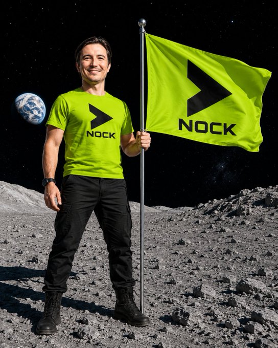 A man in a green 'NOCK' t-shirt and black pants stands on the moon's surface holding a green NOCK flag, with Earth visible in the starry background.
