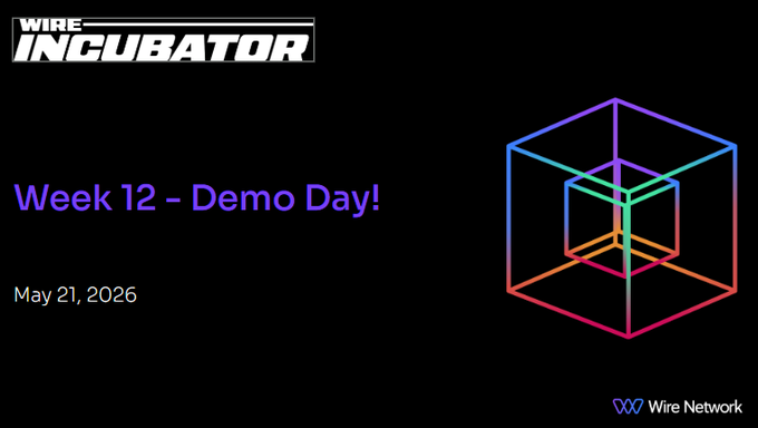 The image features a poster for an event called "The @WireNetwork Incubator" that took place at a conference. The poster displays a colorful cube design with the text "Week 12 - Demo Day!" written below it, indicating that this was the week of the demonstration. There are also some numbers and logos present on the poster, such as the number "10" and the words "@WireNetwork Incubator".