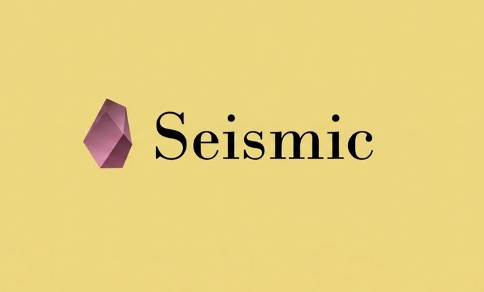 A minimalist logo design featuring a purple/magenta geometric crystal shape next to the word 'Seismic' in dark green serif typography on a beige/tan background.