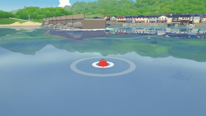 A video game screenshot shows a red bobber floating on water with a coastal village and breakwater in the background.