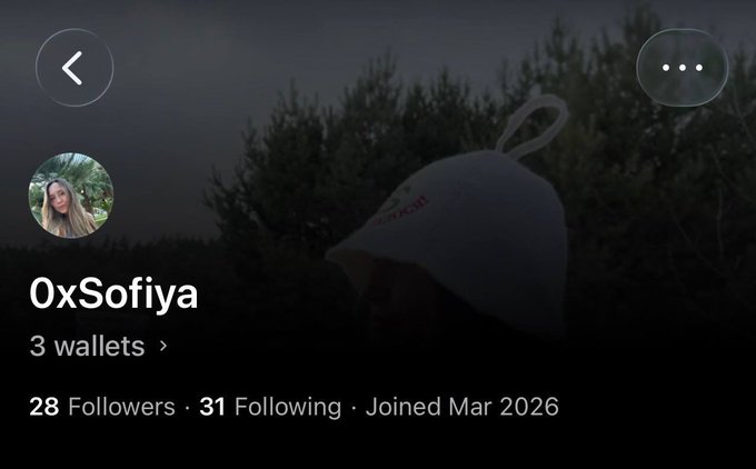The image shows a person's Twitter account featuring an image of another person wearing a white hat with a small emblem, accompanied by text that provides information about their account, such as followers and a status update. The account is named "Oxsofya" and has a "3 wallets" feature displayed. Additionally, the post contains several mentions of the hashtag #OpenSea, which indicates that the image may have been related to an OpenSea app or platform. The main focus should be on the content of the Twitter post, including the white hat with an emblem, the account name, followers, and a relevant status update from Oxsofya's account, as well as any mentions or references to #OpenSea.