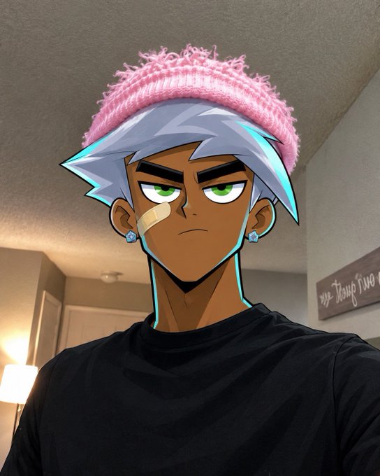 A person wearing a black shirt and pink beanie, with an anime-style filter applied giving them light blue/silver hair, green eyes, a band-aid on their cheek, and flower earrings, standing in a room with a 'vibez' sign.