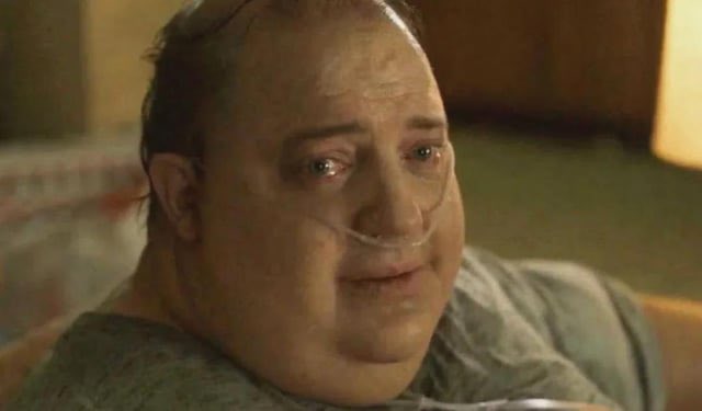 In a blurry image of an overweight man with glasses lying down on a couch, there's another person whose face isn't visible in the frame. The text in the image says "Ethereum holders don't even say ... $10k", which means that Ethereum holders are not saying anything worth saying when it comes to the price of their cryptocurrency at this moment.