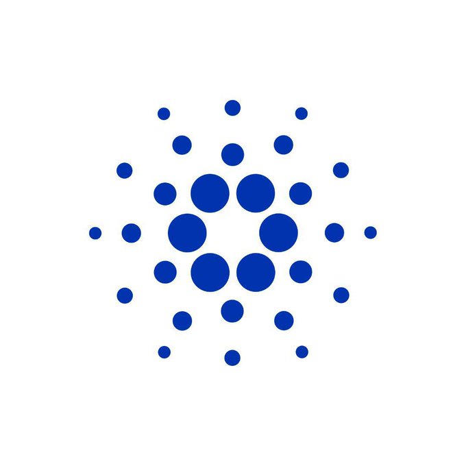 A blue dot logo consisting of a central ring of larger dots surrounded by smaller dots arranged in a radial pattern on a white background.