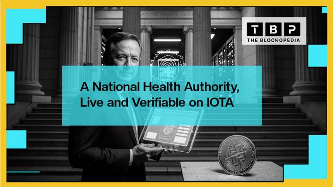 A black-and-white thumbnail from The Blockpedia titled 'A National Health Authority, Live and Verifiable on IOTA,' featuring a man holding a tablet in front of a government building.