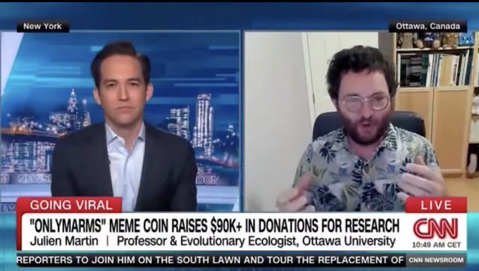 A CNN news broadcast titled "GOING VIRAL: 'ONLYMARMS' MEME COIN RAISES $90K+ IN DONATIONS FOR RESEARCH," featuring host Kaitlan Collins and guest Julien Martin.