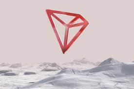 The image features a red triangle floating in the air over a snowy mountain range. The triangle appears to be made out of wire or metal, giving it an abstract and futuristic appearance. The background consists of mountains covered in snow, creating a stark contrast between the warm colors of the triangle and the cool tones of the snow. The post also mentions that the TRON Network is quietly ushering in explosive growth markets, which could be interpreted as the triangle symbolizing the rapid growth and expansion of the network.