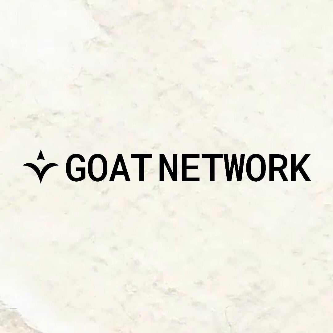The image features a white background with black text that reads "GOAT NETWORK". The text is capitalized, which makes it stand out against the white background. The image also includes an image of a goat network logo, which adds visual interest to the overall composition.