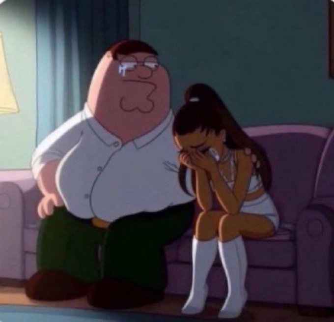 The image features a man sitting on a couch with his eyes closed, looking sad or distressed. Next to him, there's a woman wearing a white dress who appears to be crying as well. The background of the image shows a window behind them, suggesting that they are in an indoor setting like a living room. The caption for this image reads: "Just told my gf about the Bitcoin crash last night."