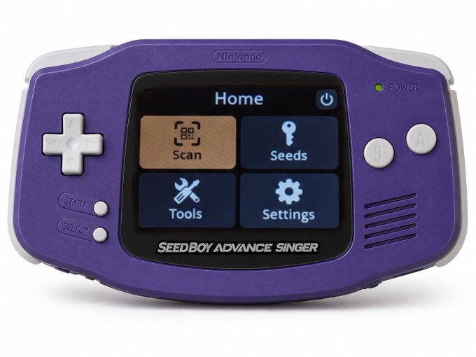 A purple Nintendo Game Boy Advance handheld console modified as the 'SEEDBOY ADVANCE SINGER', displaying a home screen with options for Scan, Seeds, Tools, and Settings.